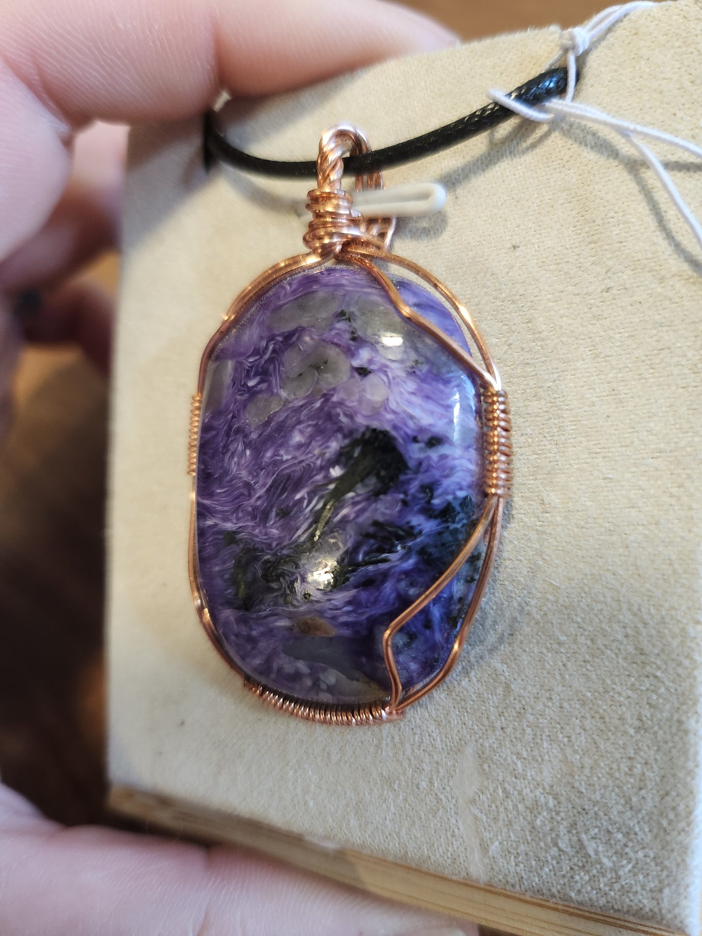 Charoite wrapped in Copper